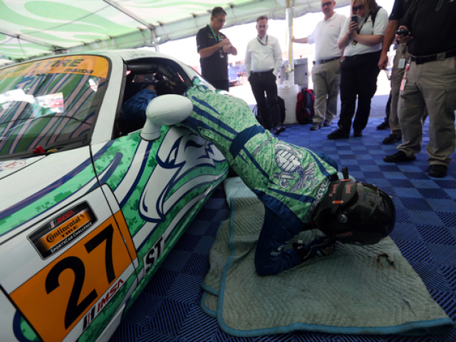 Mazda Motorsports RacerLiam Dwyer Exiting the Race Car