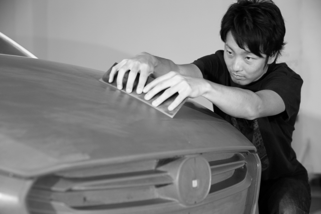 Mazda Vehicle Designer Sculpting a Clay Model