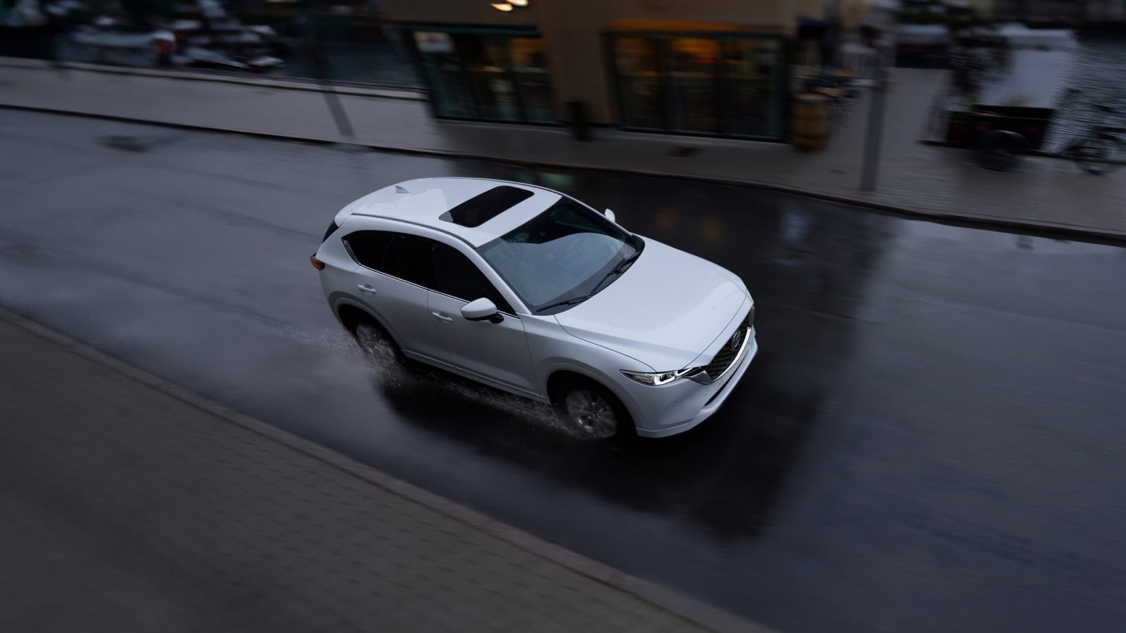 2025 Mazda cx-5 in white driving through rain