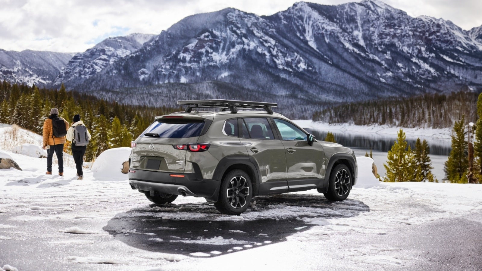 2025 Mazda cx-50 in green parked in snowy mountain range