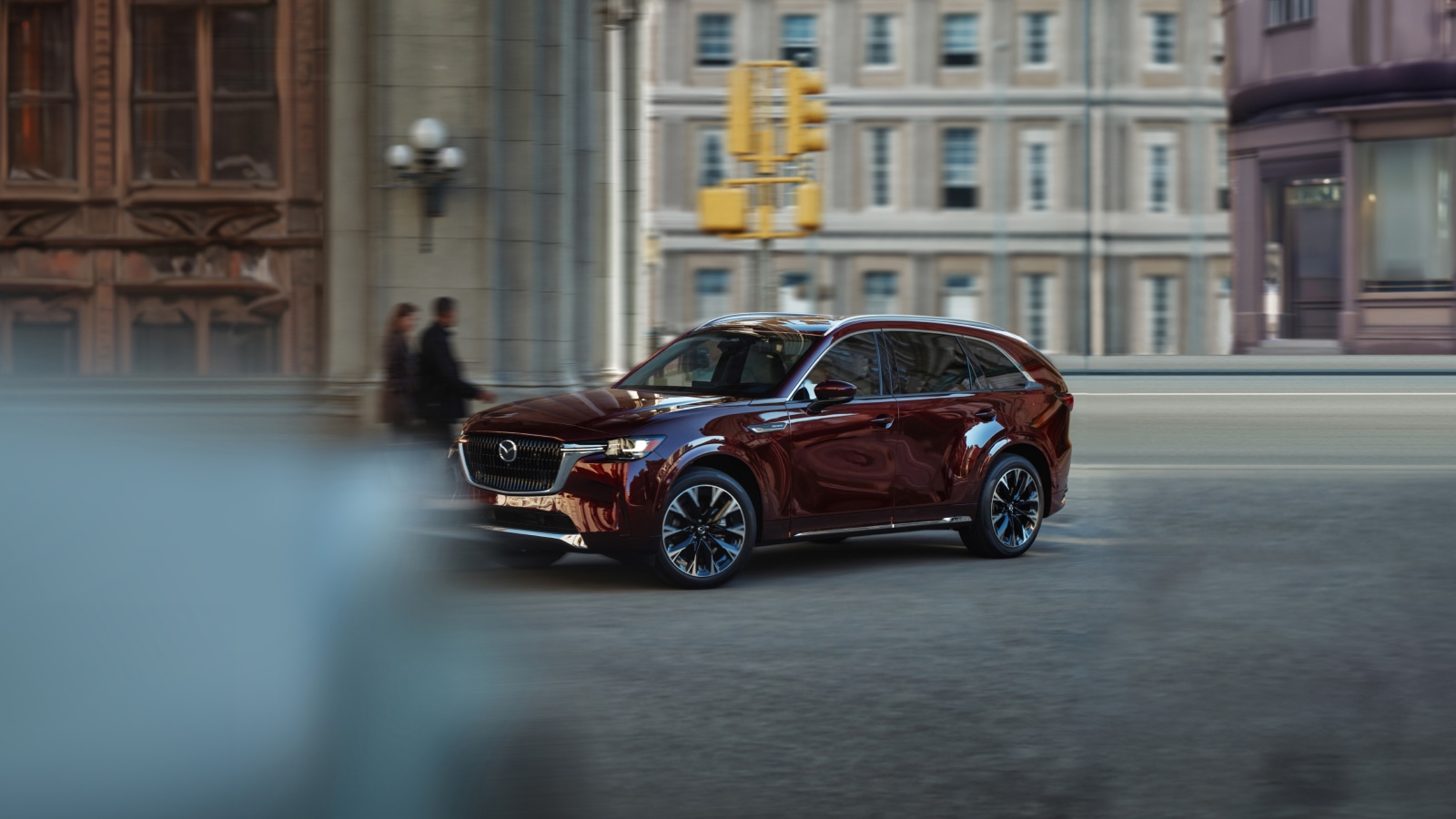 2025 mazda cx-90 phev driving through city