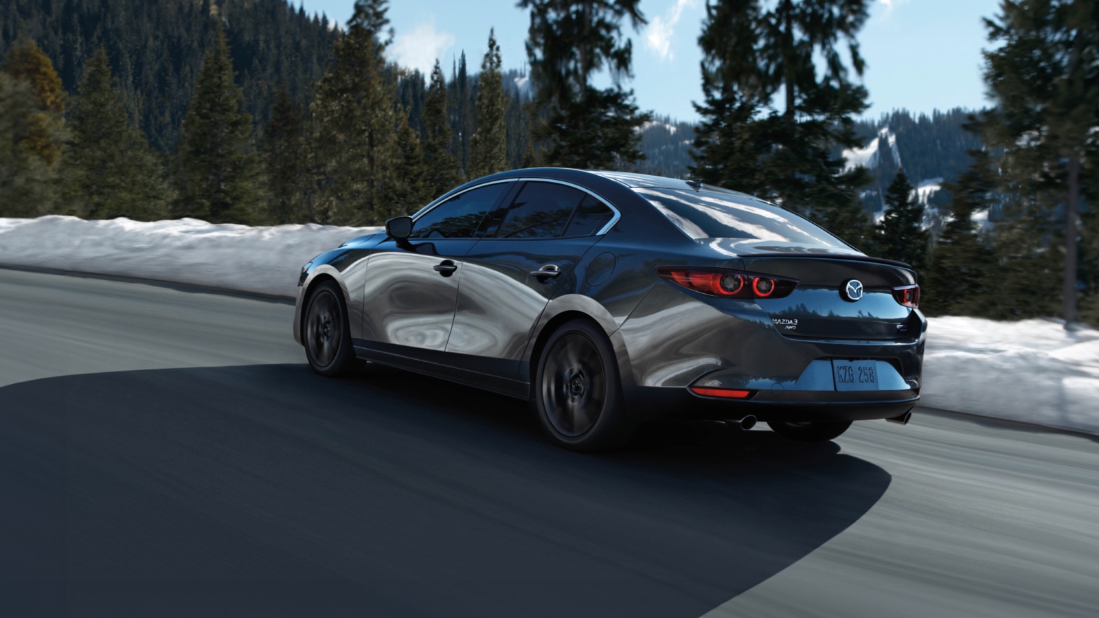 2025 Mazda3 parked on snowy city street