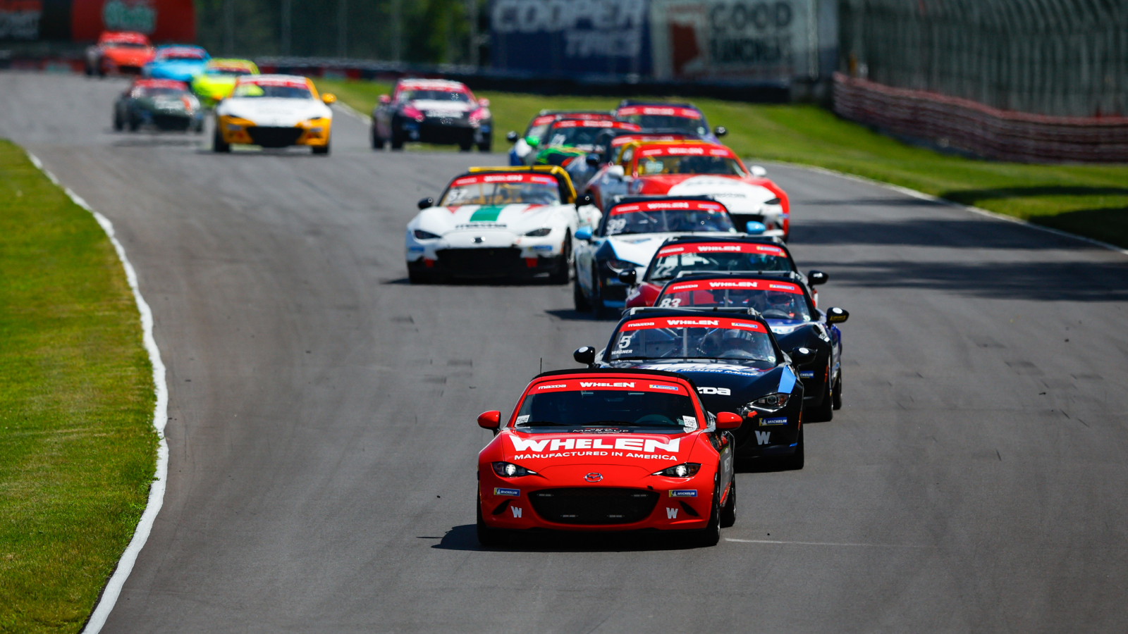 Mazda MX-5 Miata Heritage – Lineup of MX-5 on a Track